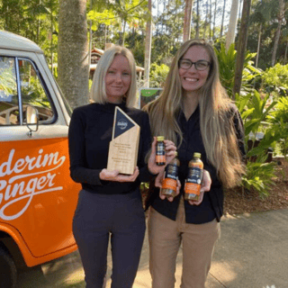Buderim Ginger van with Millie Mae and Dani Russell showcasing the award and new products.