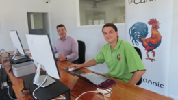 Two Canntic workers sits at a desk with computers